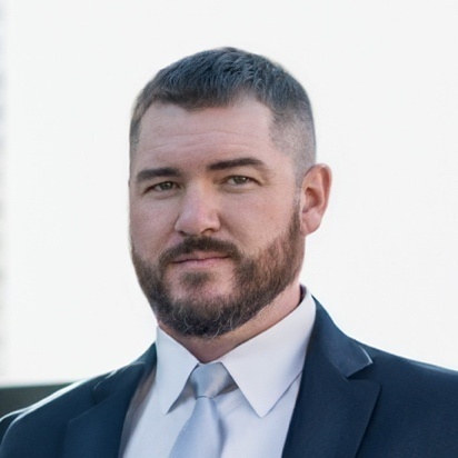 Portrait of Corey Boaz, founder of Omega Global